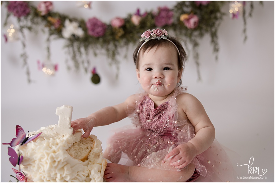 baby eating birthday cake