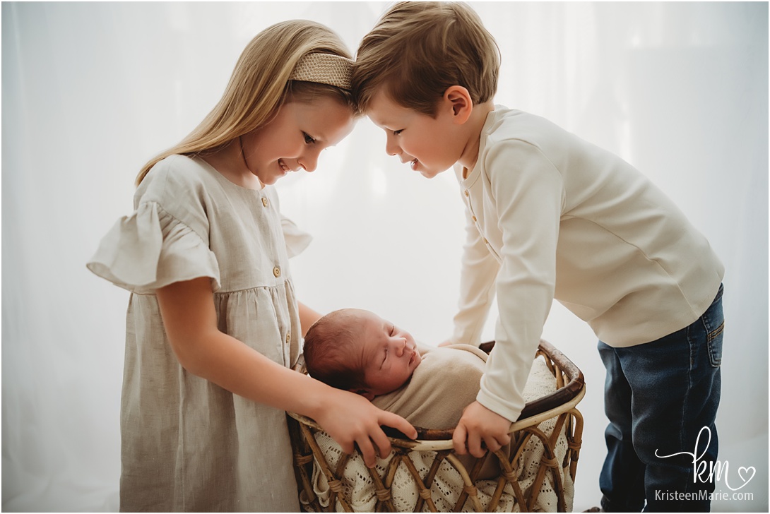 newborn baby with two big siblings - Carmel Family Photographer