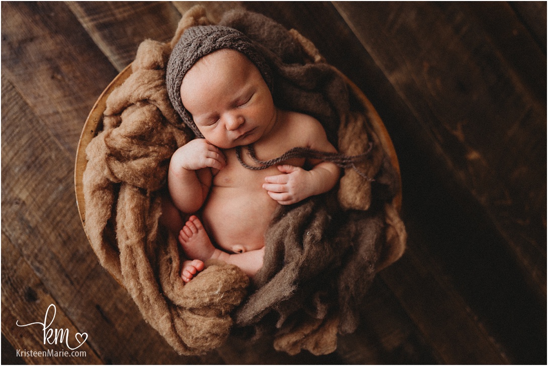 newborn baby boy in a bowl - Indianapolis newborn photographer