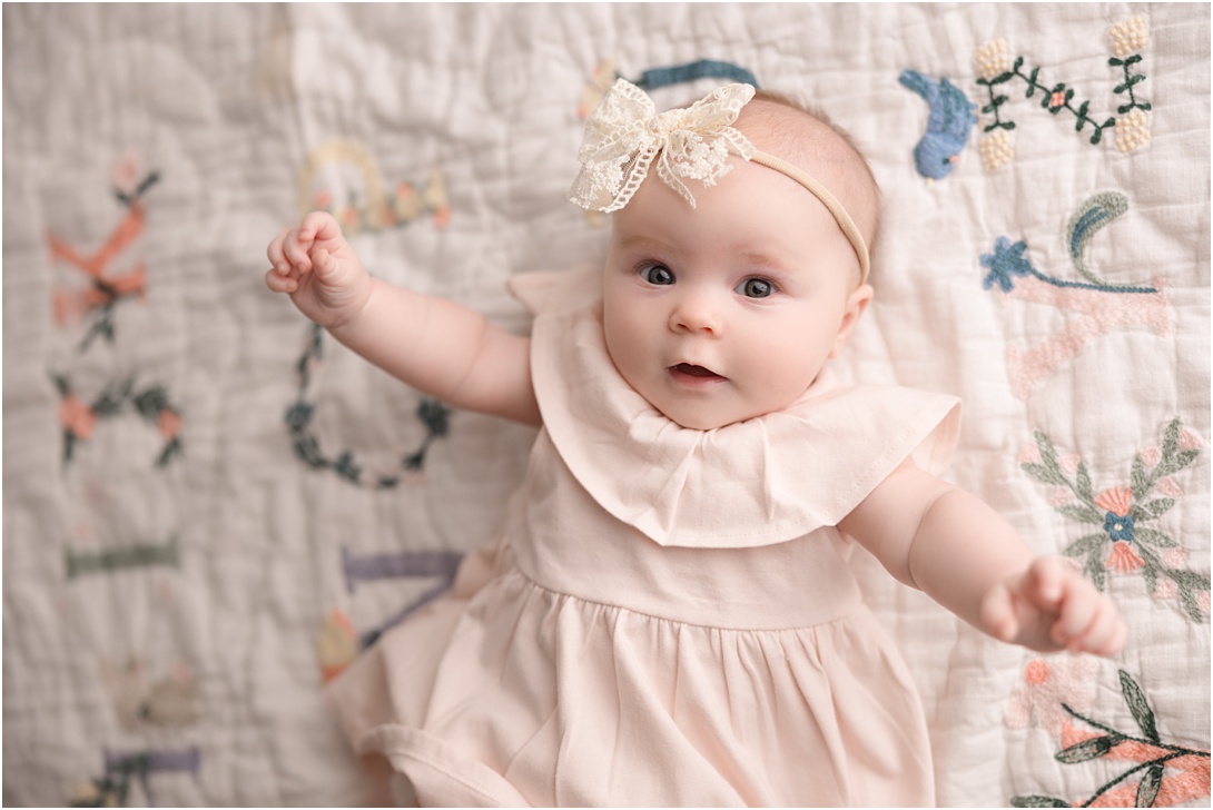 sweet 4-month old girl during in-studio milestone photography session