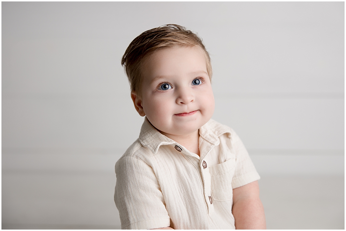 sweet baby boy smiling for 1st birthday pictures