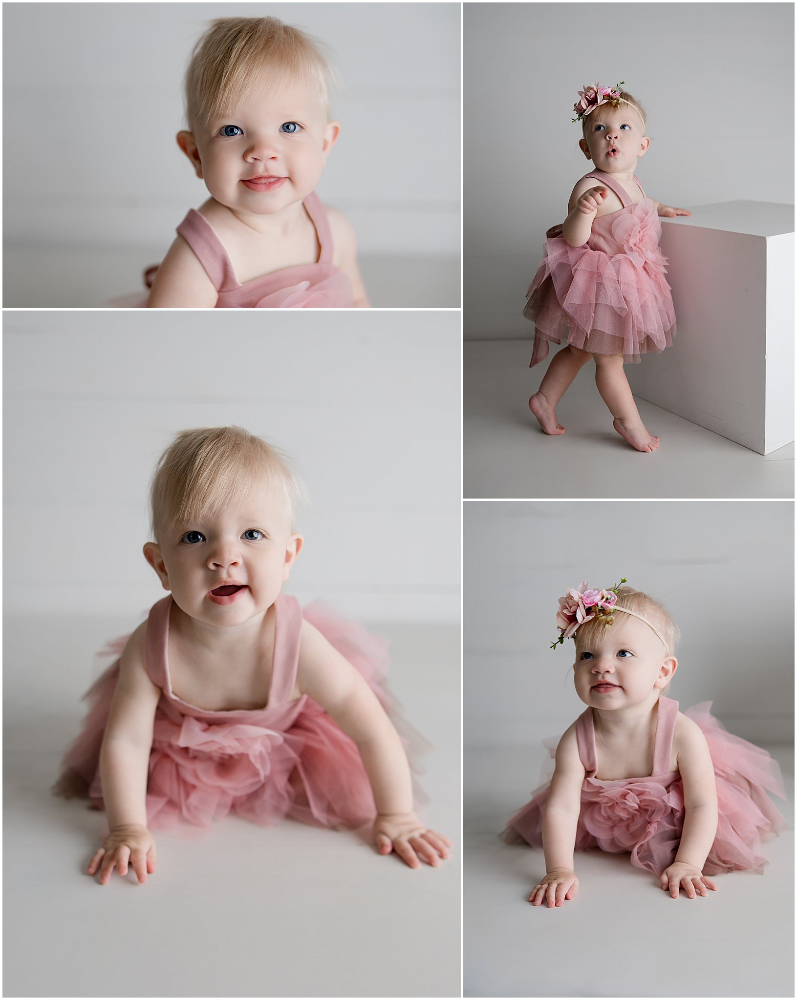Baby girl wearing floral headband and pink dress with birthday cake in Zionsville studio
