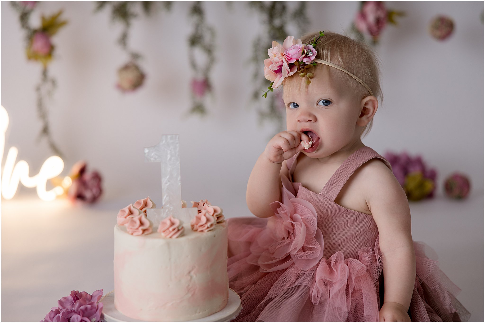 One-year-old tasting cake during Zionsville cake smash photography session