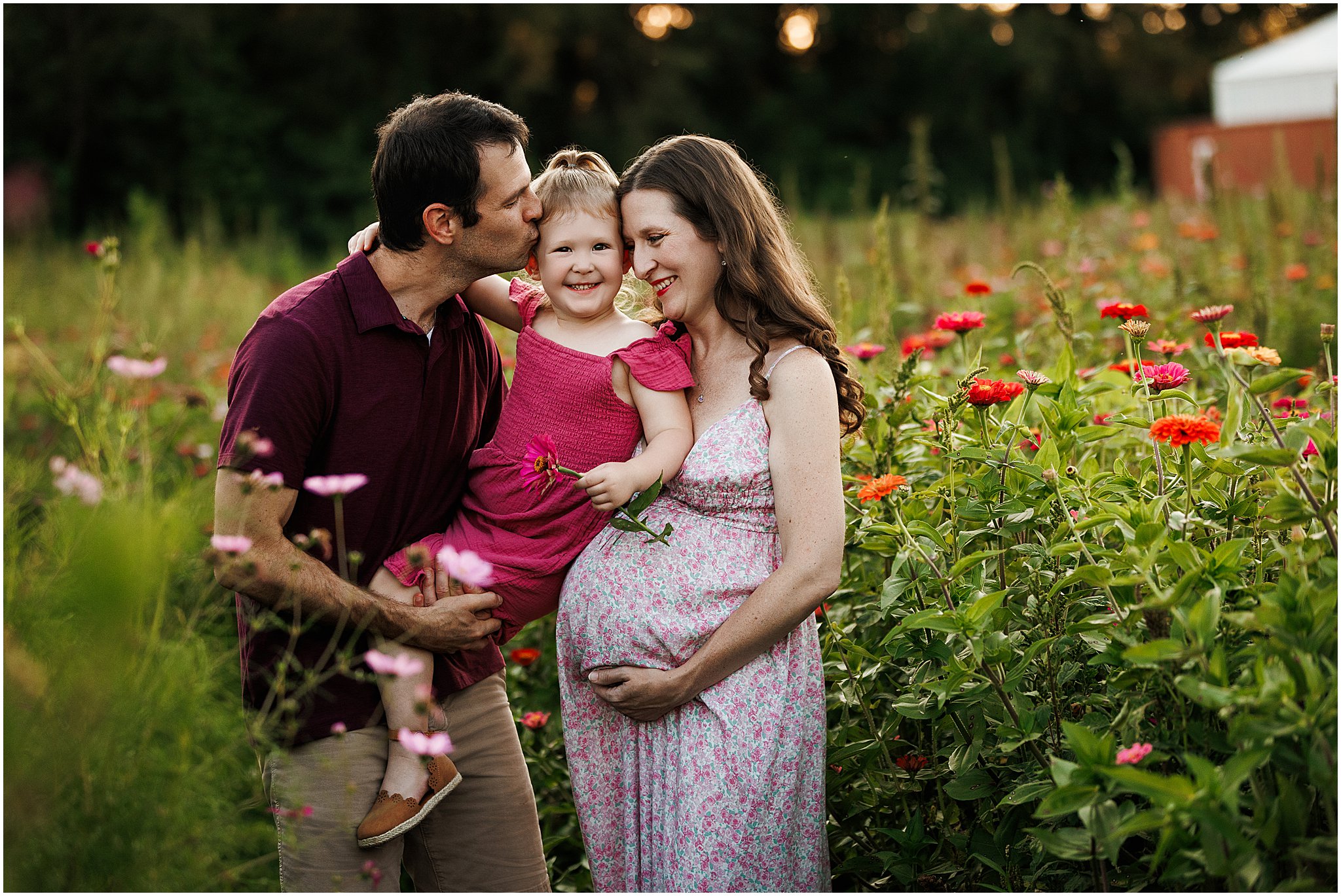 Maternity portraits at Dull’s Tree Farm near Indianapolis with bright wildflowers and glowing parents awaiting their little one.