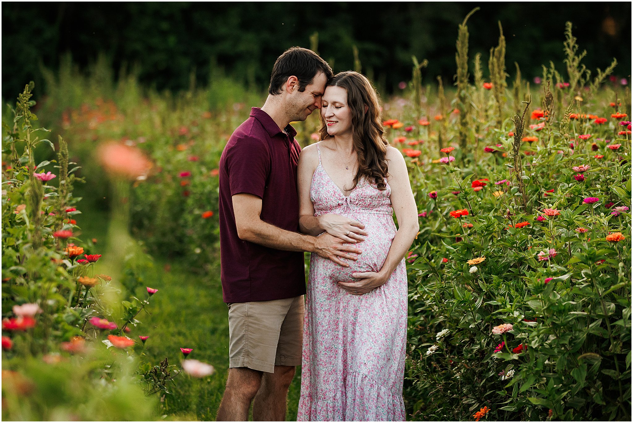 husband and wife expecting - adorable baby bump in wildflower field - Indianapolis maternity photography