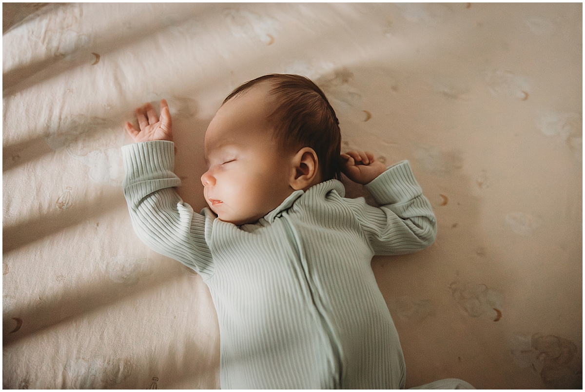 Baby sleeping in a bright Indianapolis nursery during in-home newborn session