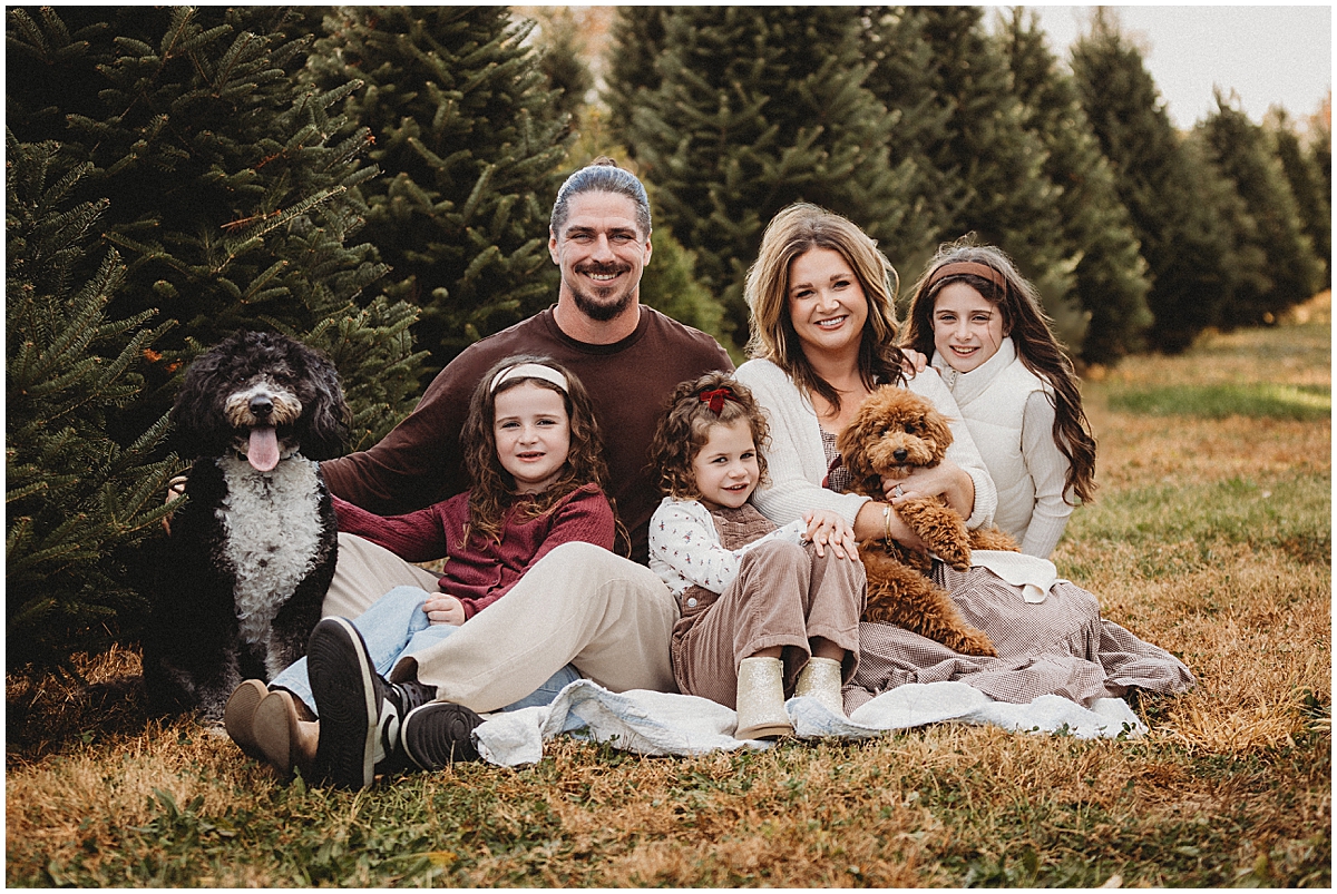 family with dogs at Tree Farm for family pictures
