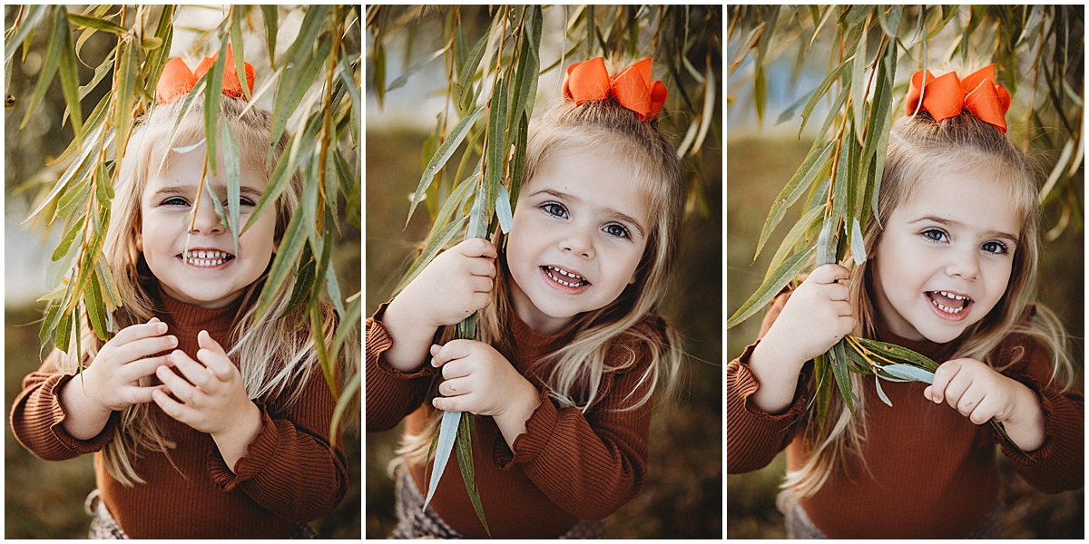 Little girl smiling during fall photos in Carmel Indiana by Carmel Family Photographer