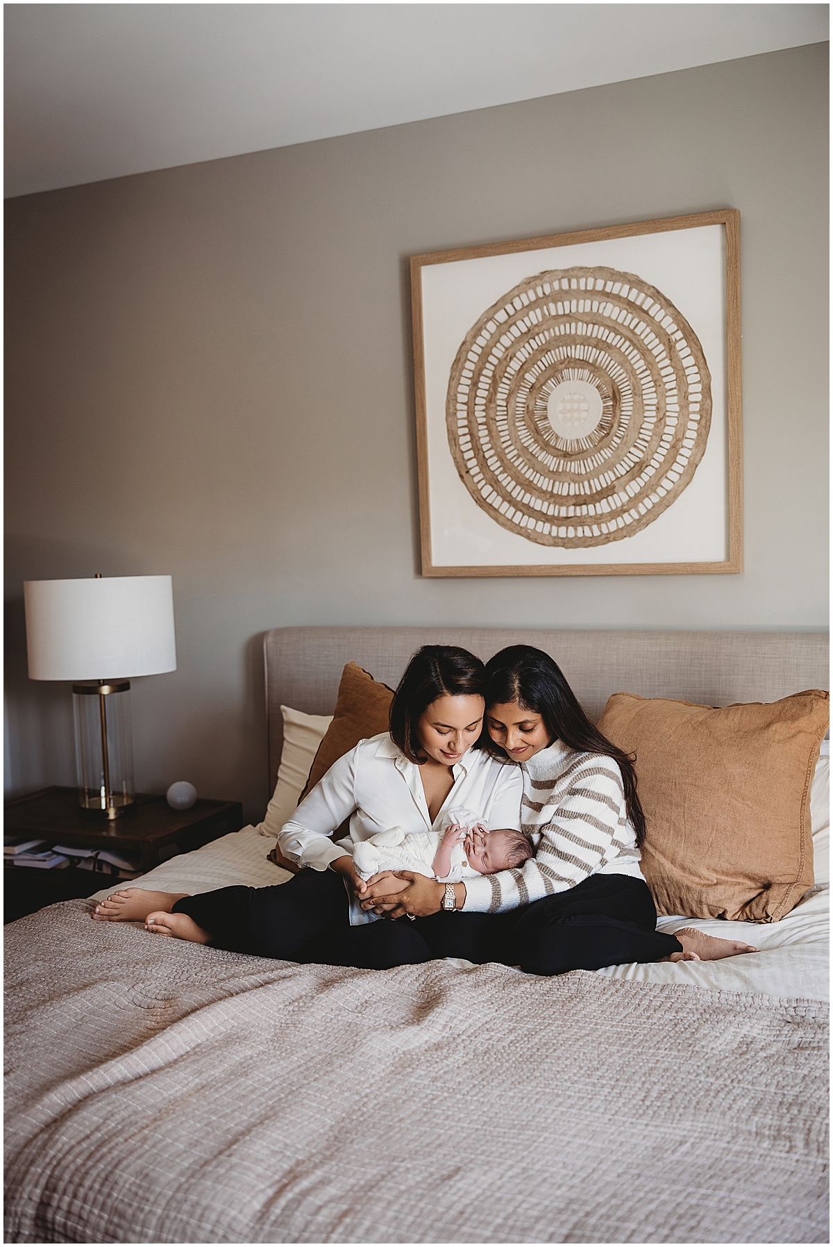 First-time same-sex parents during an in-home newborn session in Zionsville Indiana