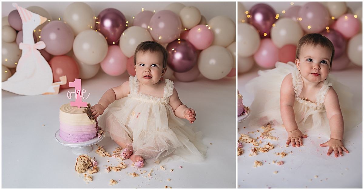 Zionsville cake smash photographer pastel pink and cream first birthday cake with balloon backdrop