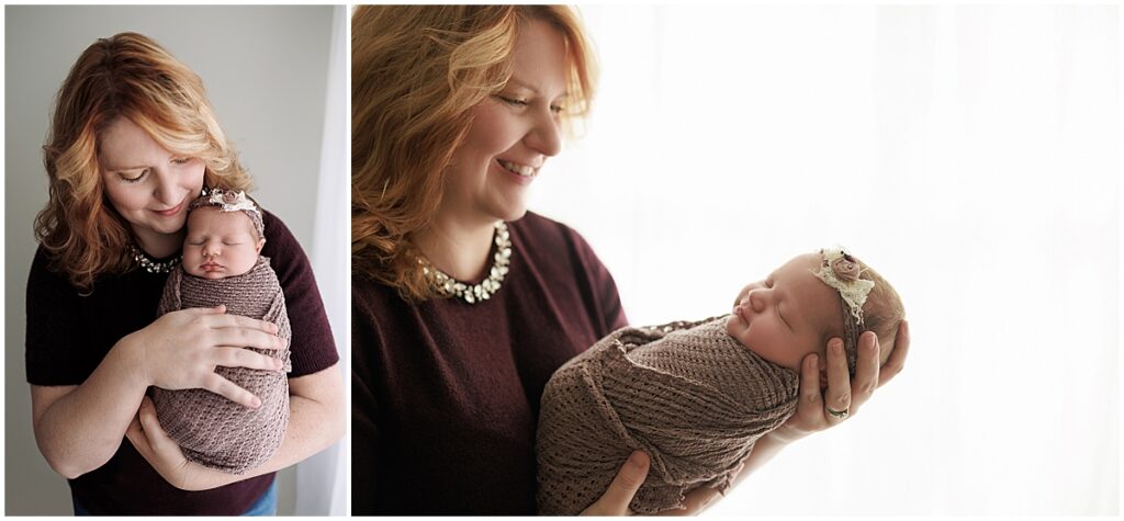 Mother holding and smiling at her newborn baby in softly lit studio portraits.