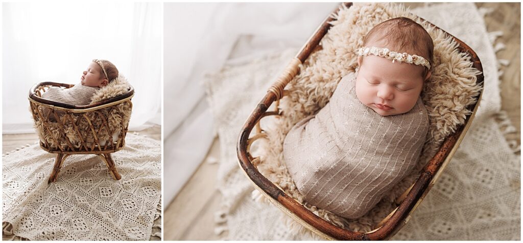 Sleeping newborn baby wrapped in neutral fabric in a small studio basket.